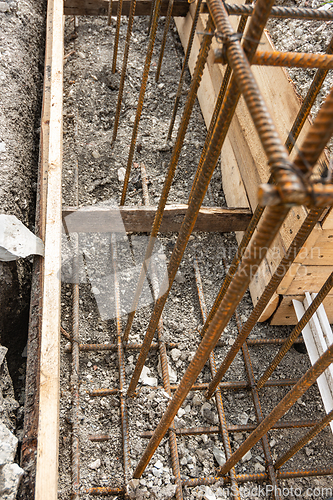 Image of Reinforcement covered with earth during formwork collapse