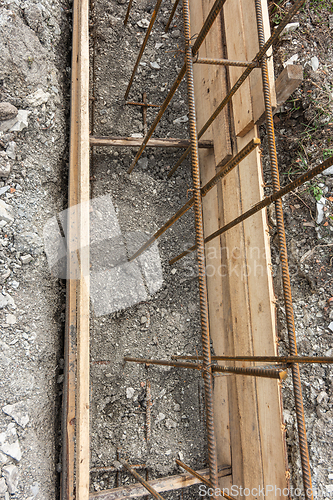 Image of Partially buried bonded reinforcement and strip foundation formwork