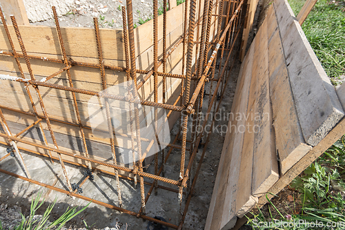 Image of Installation of formwork during the construction of a strip, shallow foundation, close-up