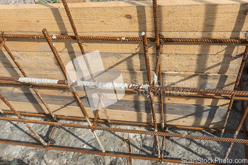 Image of Tied reinforcement and mounted strip foundation formwork close-up