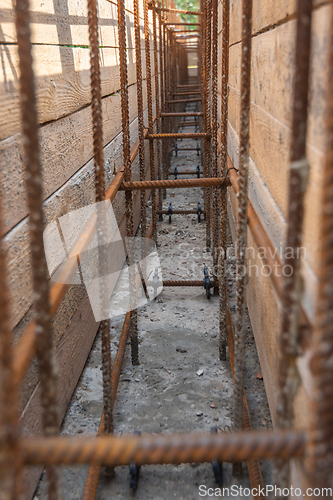 Image of Tied rebar and mounted formwork close-up, view inside the trench