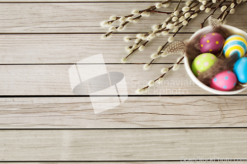 Image of colored easter eggs and pussy willow branches