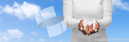 Image of close up of african american woman holding couple