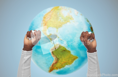 Image of hands of african american woman showing fists