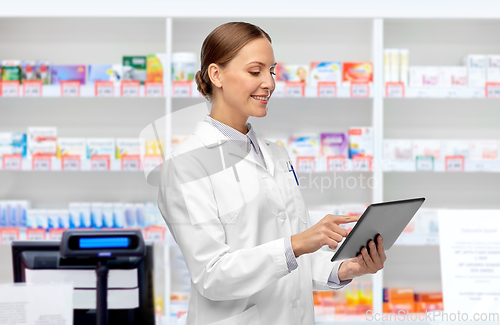 Image of female doctor with tablet pc at pharmacy