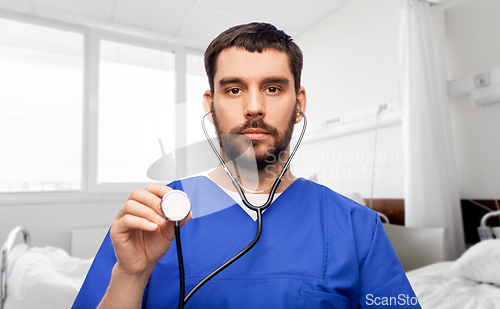 Image of doctor or male nurse with stethoscope