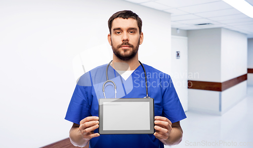 Image of doctor or male nurse showing tablet computer