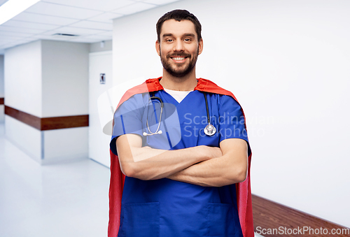 Image of doctor or male nurse in superhero cape at hospital