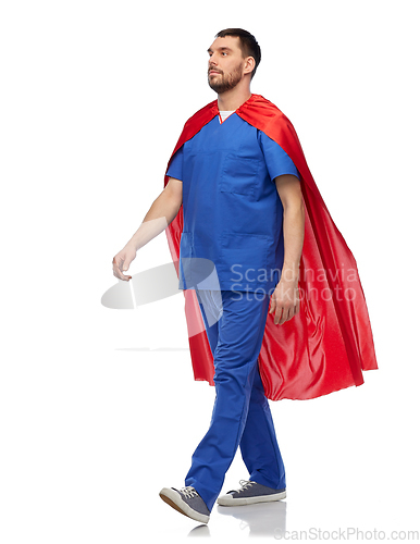 Image of doctor or male nurse in superhero cape walking