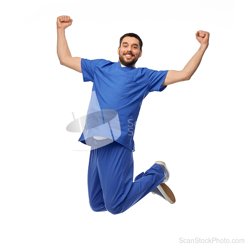 Image of happy smiling doctor or male nurse jumping in air