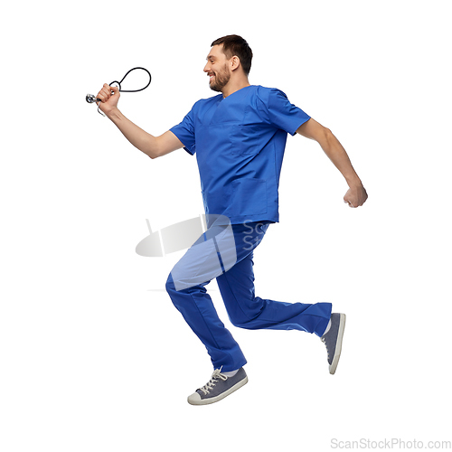 Image of doctor or male nurse with stethoscope jumping