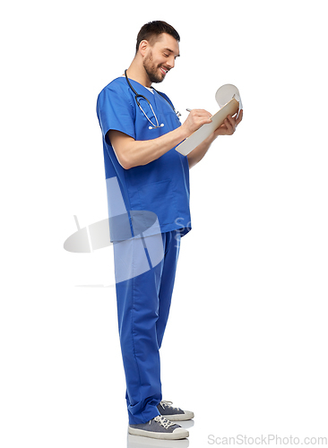 Image of male doctor writing medical report on clipboard