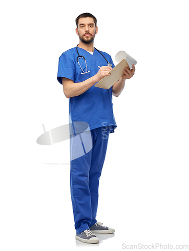 Image of male doctor writing medical report on clipboard