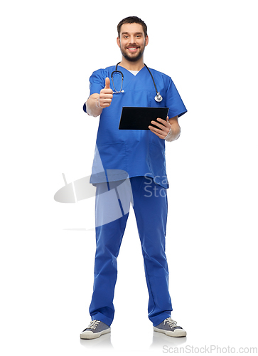 Image of happy male doctor with tablet pc showing thumbs up