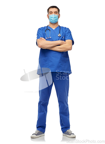 Image of male doctor in blue uniform and mask