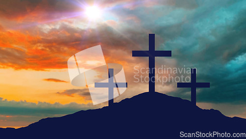 Image of silhouettes of three crosses on calvary hill