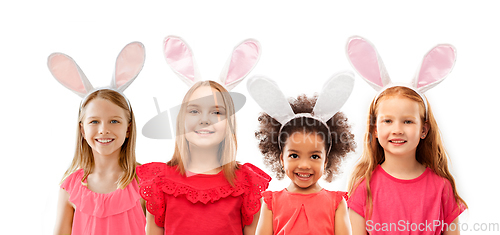 Image of happy girls wearing easter bunny ears headbands