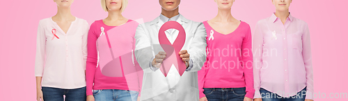 Image of female doctor with breast cancer awareness ribbon