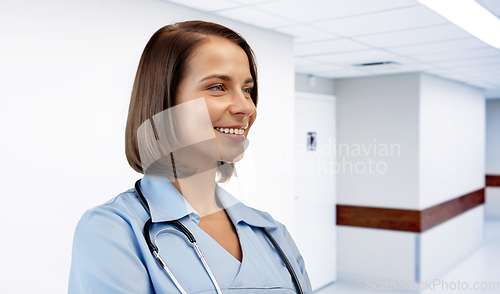 Image of smiling female doctor or nurse at hospital