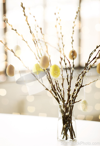 Image of pussy willow branches decorated by easter eggs