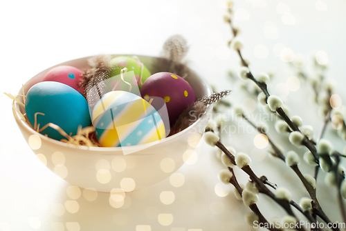 Image of colored easter eggs and pussy willow branches