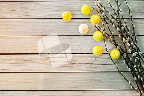 Image of pussy willow branches and easter egg candles