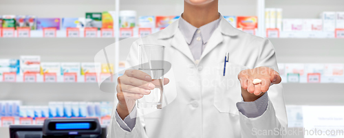 Image of female doctor with medicine and water pharmacy