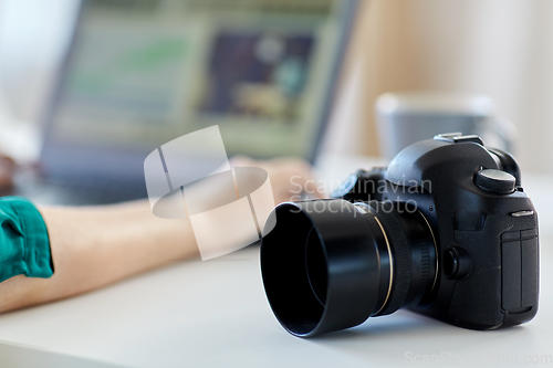 Image of close up of digital camera on table