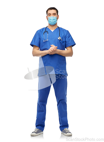 Image of male doctor in blue uniform and mask