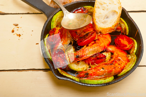 Image of roasted shrimps with zucchini and tomatoes