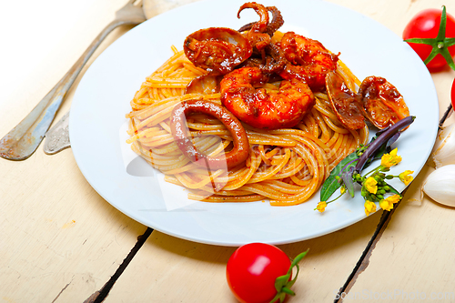 Image of Italian seafood spaghetti pasta on red tomato sauce