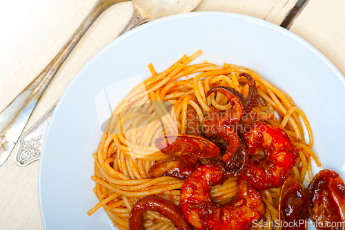 Image of Italian seafood spaghetti pasta on red tomato sauce