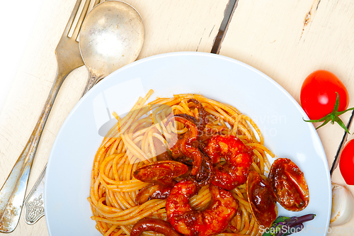 Image of Italian seafood spaghetti pasta on red tomato sauce