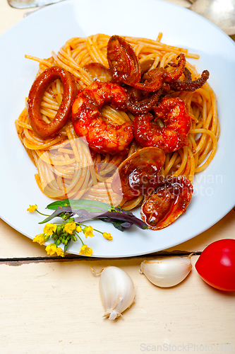 Image of Italian seafood spaghetti pasta on red tomato sauce