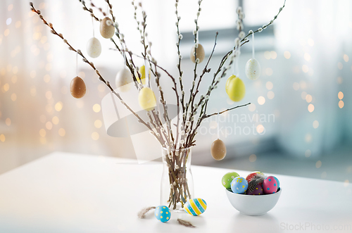 Image of pussy willow branches decorated by easter eggs