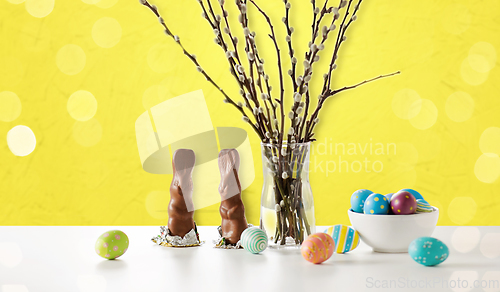 Image of pussy willow, easter eggs and chocolate bunnies