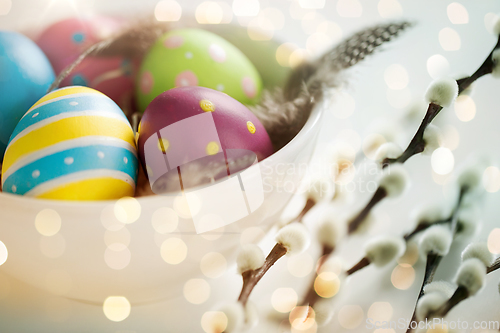 Image of colored easter eggs and pussy willow branches