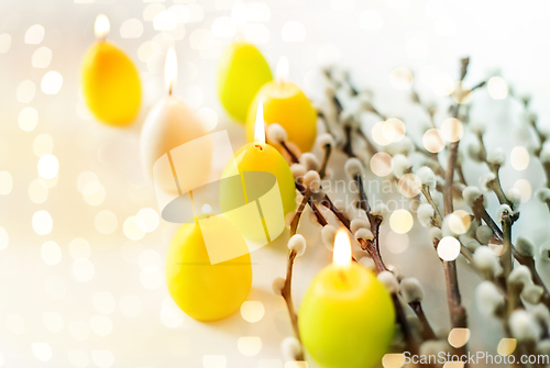 Image of pussy willow branches and easter egg candles