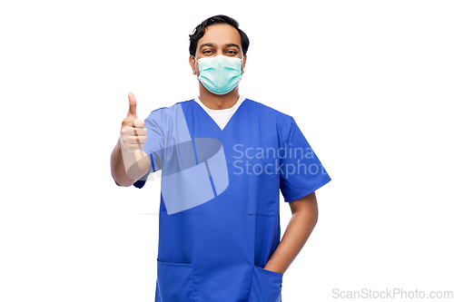 Image of indian male doctor in mask showing thumbs up