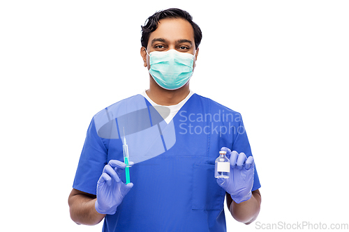 Image of indian doctor in mask with syringe and medicine