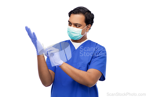 Image of indian male doctor in uniform, mask and gloves