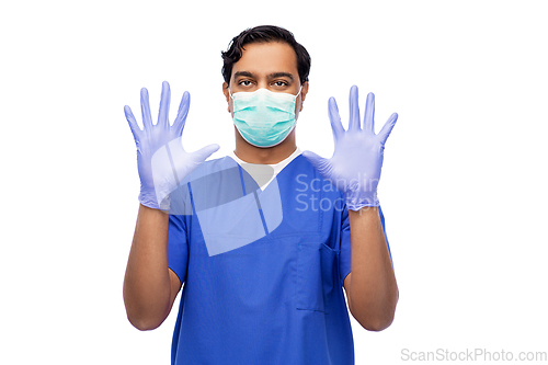 Image of indian male doctor in uniform, mask and gloves