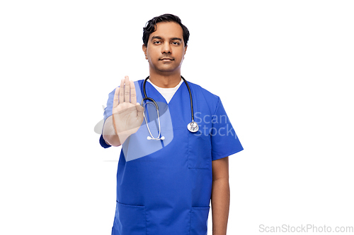 Image of indian doctor or male nurse showing stop gesture