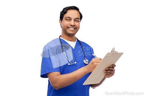 Image of male doctor writing medical report on clipboard