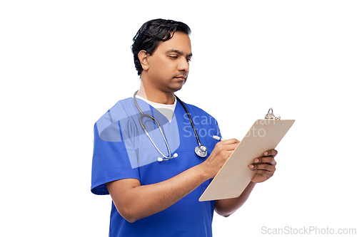 Image of male doctor writing medical report on clipboard