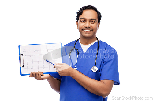 Image of smiling male doctor with cardiogram on clipboard