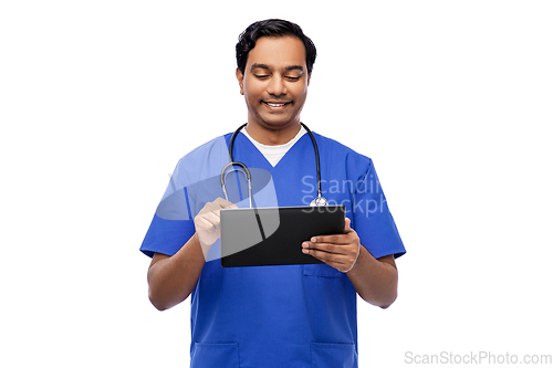 Image of smiling doctor or male nurse using tablet computer