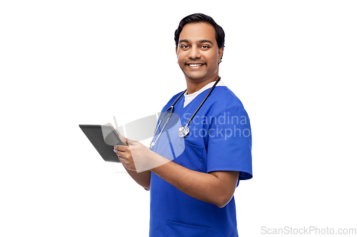 Image of smiling doctor or male nurse using tablet computer