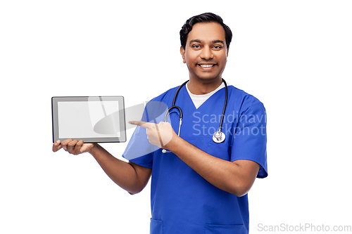 Image of happy doctor or male nurse showing tablet computer