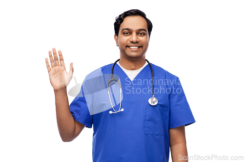 Image of doctor or male nurse with stethoscope waving hand